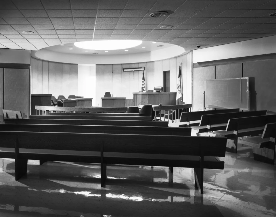 Black and white photograph of a large courtroom in Des Moines County, Iowa
