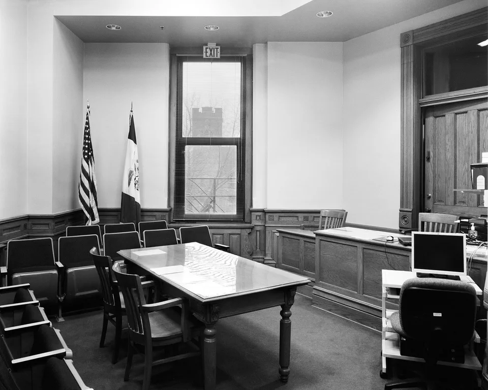 Black and white photograph of a small courtroom in Iowa County, Iowa